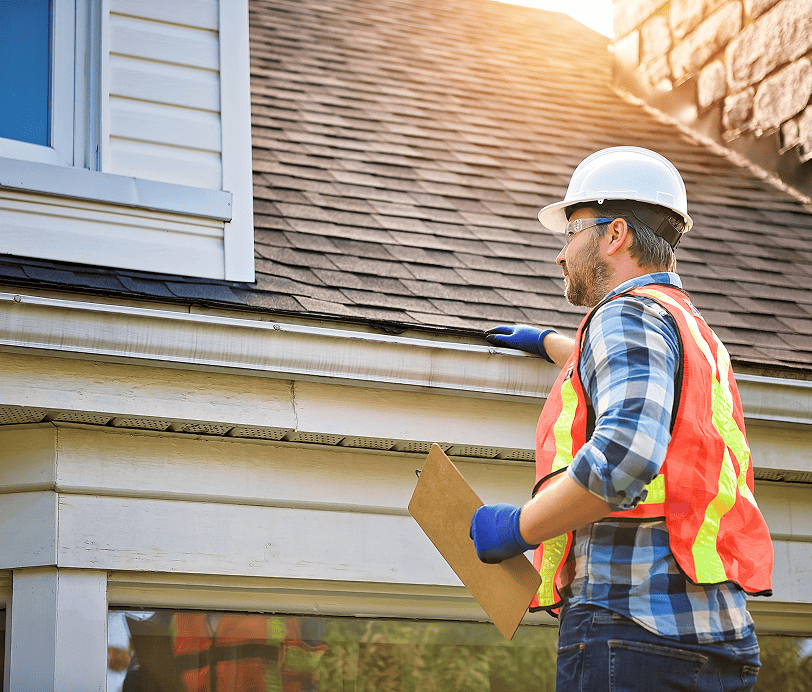 Man Working on Roof Inspection