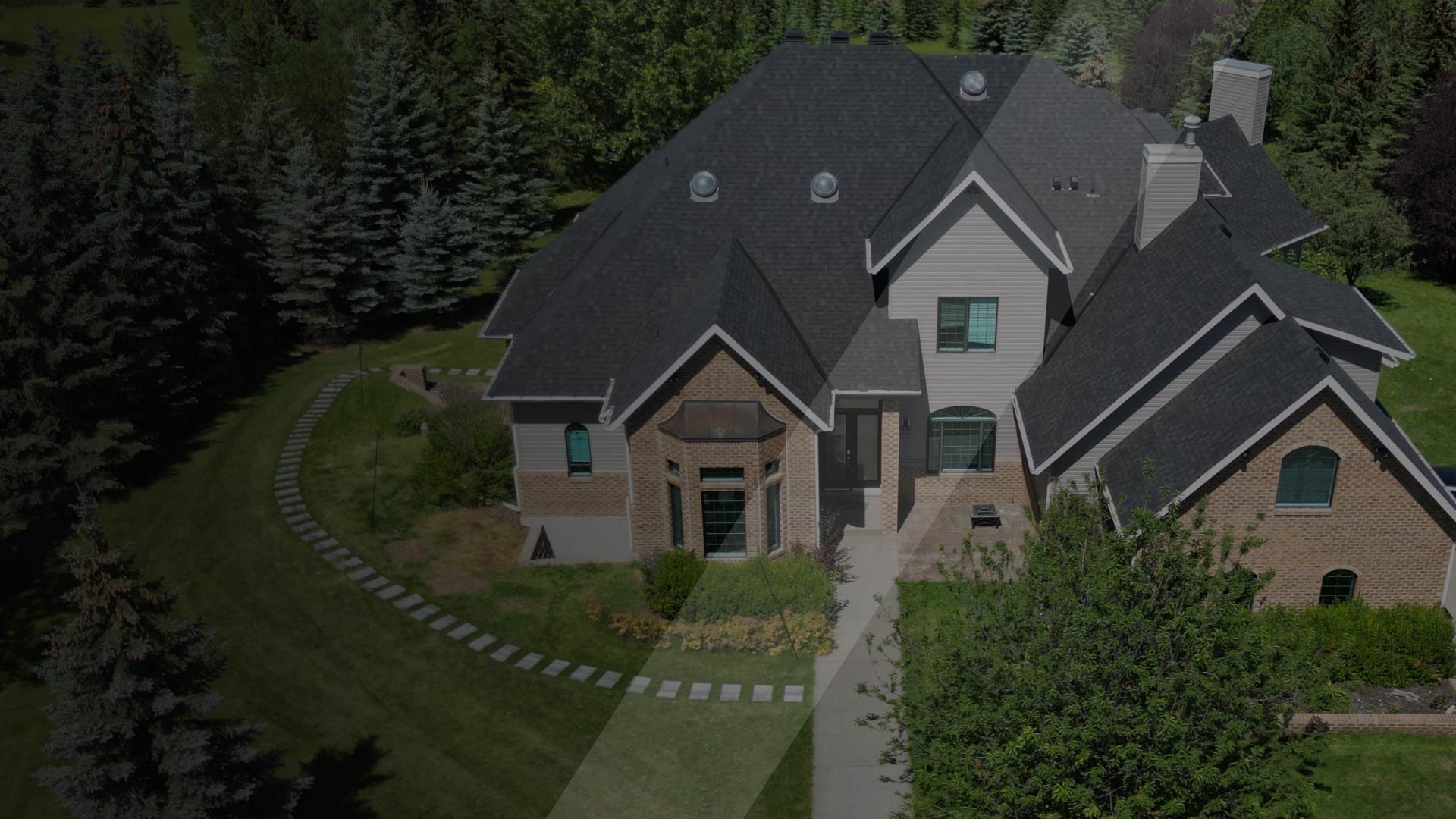 Aerial view of roofing on luxury home