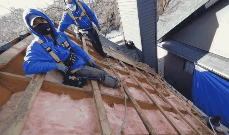 Roofing contractor working in roof repair 768x455