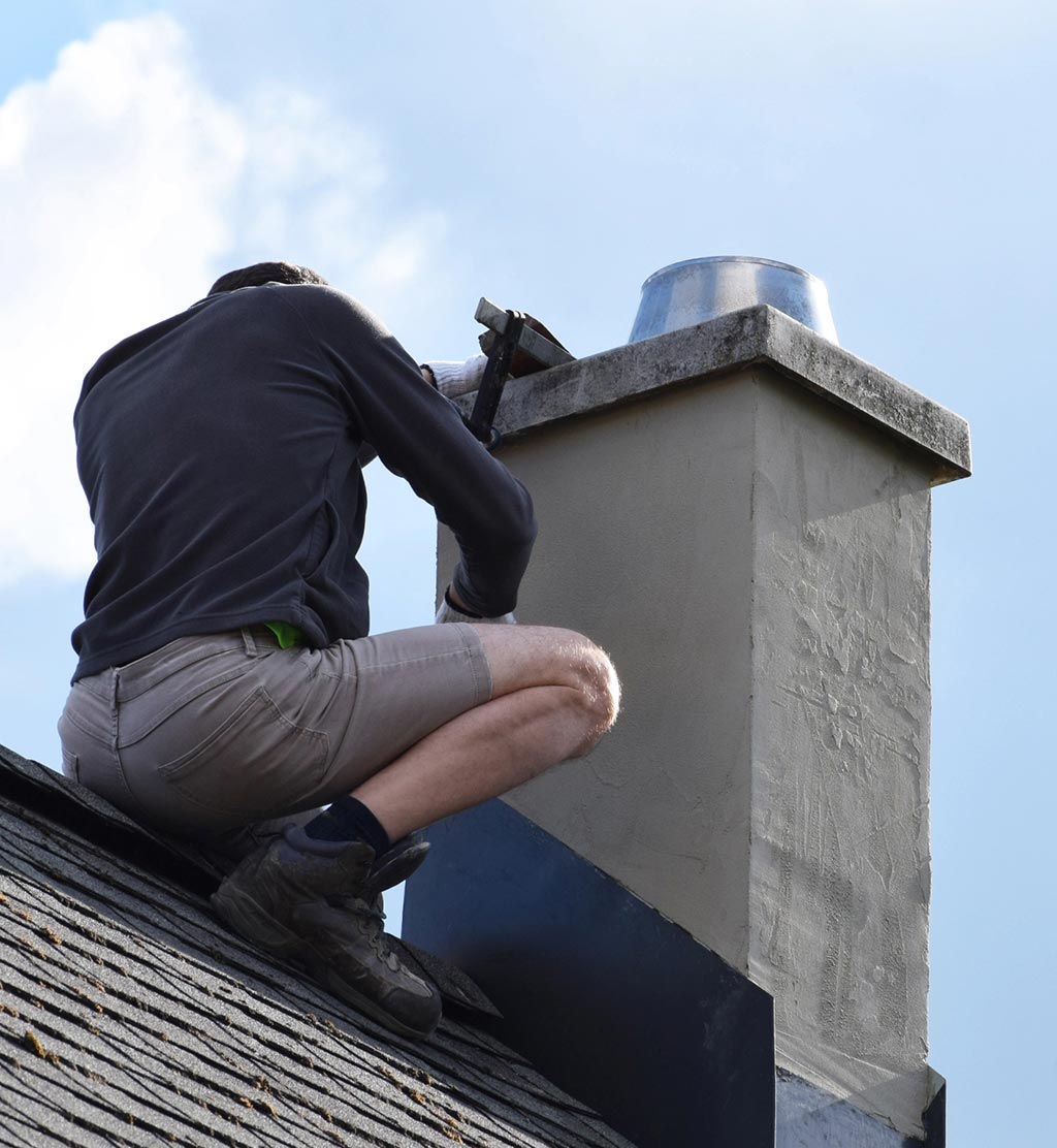 Man repairing chimney
